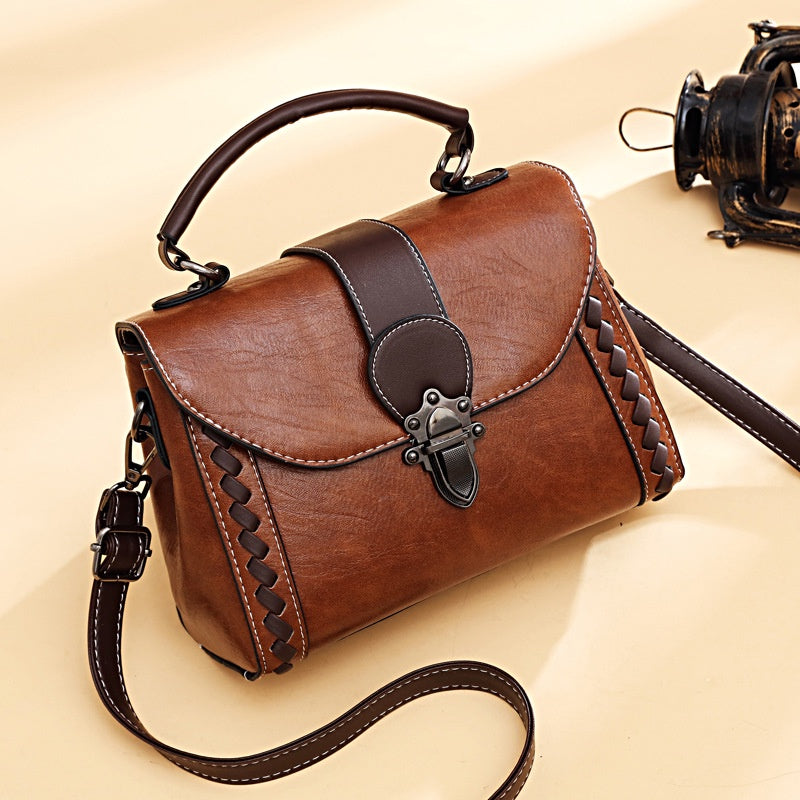 IELGY fashion wear-resistant rivet messenger handbag retro