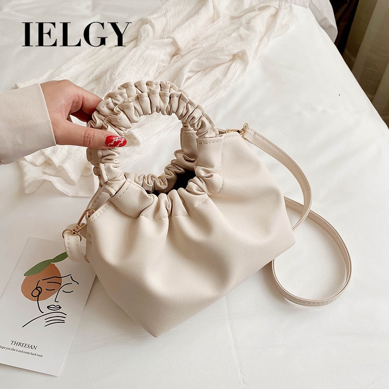 Plain color and retro fashion style handbag for women