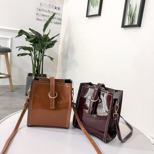 Glossy retro messenger bag