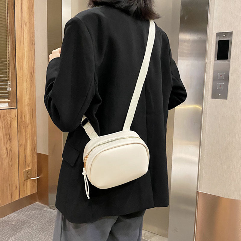 IELGY broadband Popular high-end oval smooth zipper woman's cute crossbody bag versatile one-shoulder