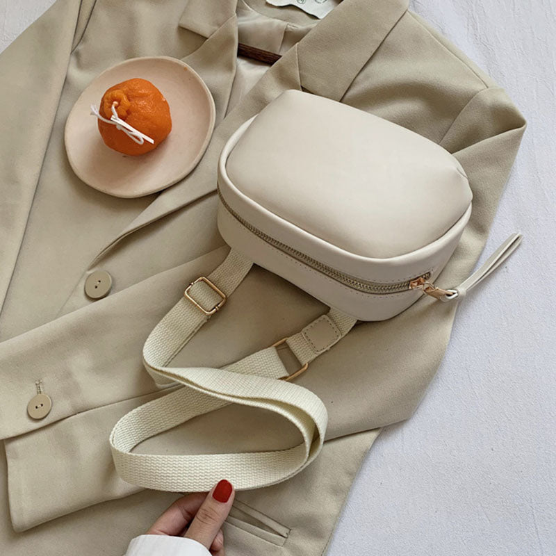 IELGY broadband Popular high-end oval smooth zipper woman's cute crossbody bag versatile one-shoulder