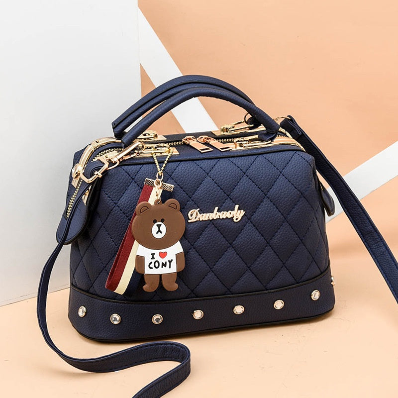 IELGY Korean style fashion rivet cartoon pendant messenger bag women