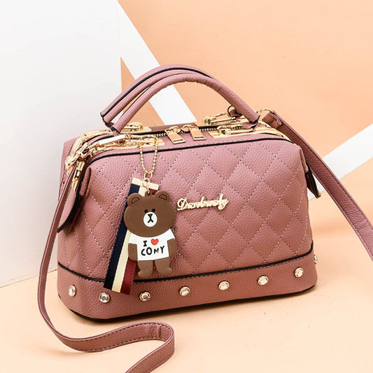 IELGY Korean style fashion rivet cartoon pendant messenger bag women