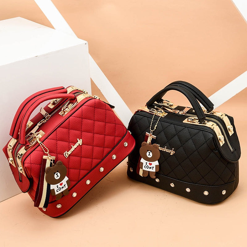 IELGY Korean style fashion rivet cartoon pendant messenger bag women