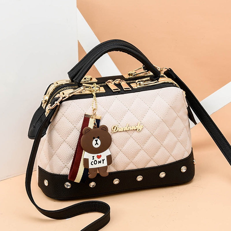 IELGY Korean style fashion rivet cartoon pendant messenger bag women