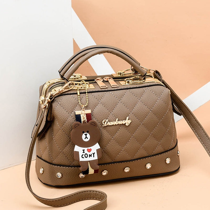 IELGY Korean style fashion rivet cartoon pendant messenger bag women