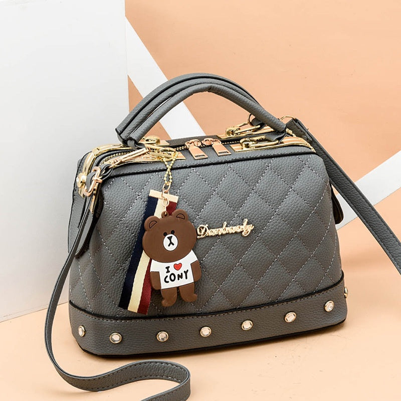 IELGY Korean style fashion rivet cartoon pendant messenger bag women