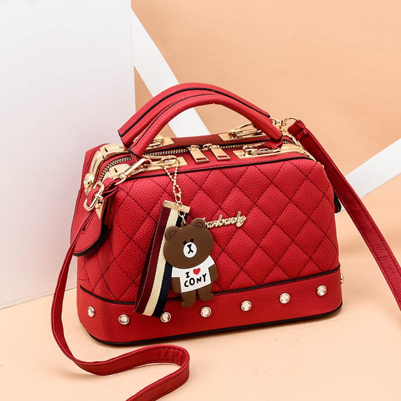 IELGY Korean style fashion rivet cartoon pendant messenger bag women