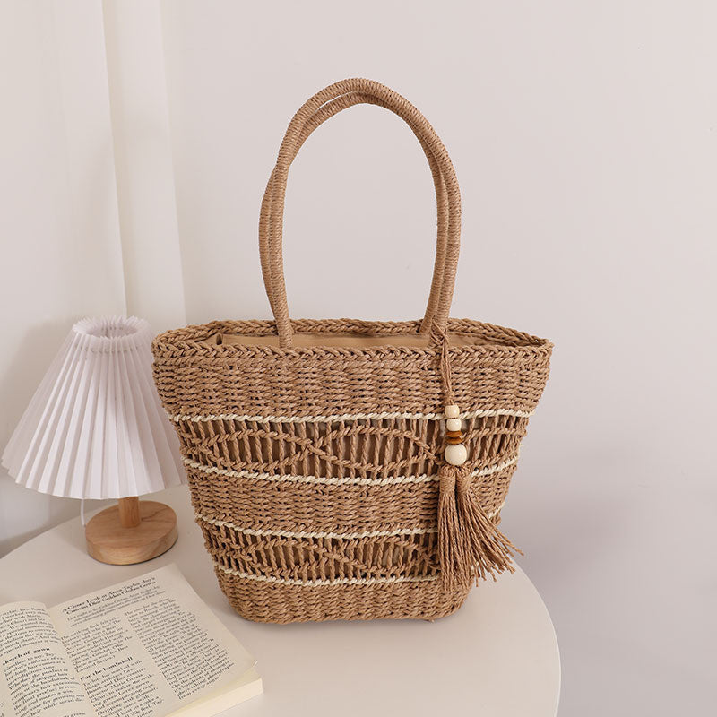 Ielgy Fashion Hollow One-Shoulder Straw Bag Tassel Portable Woven Holiday Style Beach Female Bag