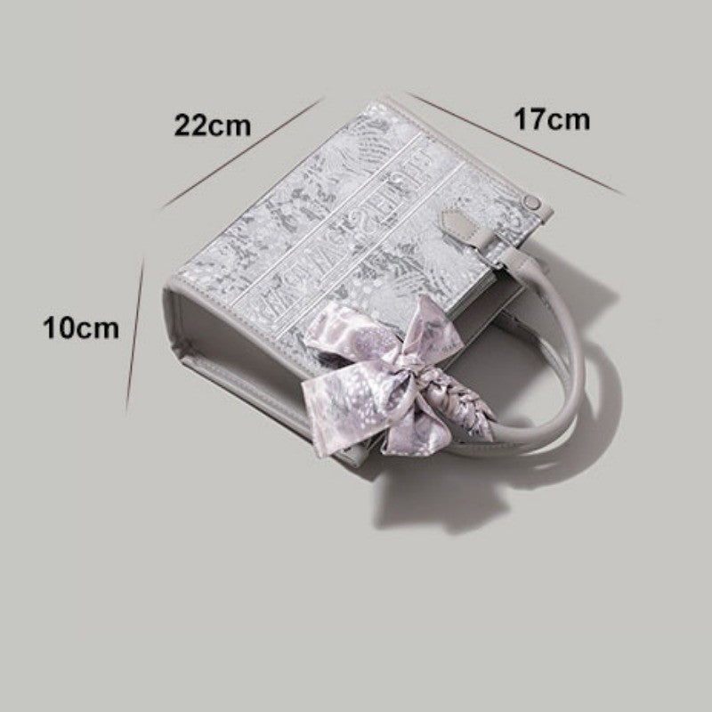 Ielgy Commuter Tote Bag High-End Pattern Embroidery Portable One-Shoulder Diagonal Shopping Bag (Ribbon Style Random Shipping)