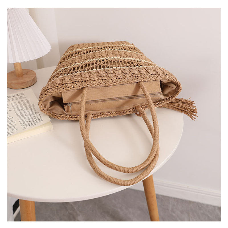 Ielgy Fashion Hollow One-Shoulder Straw Bag Tassel Portable Woven Holiday Style Beach Female Bag