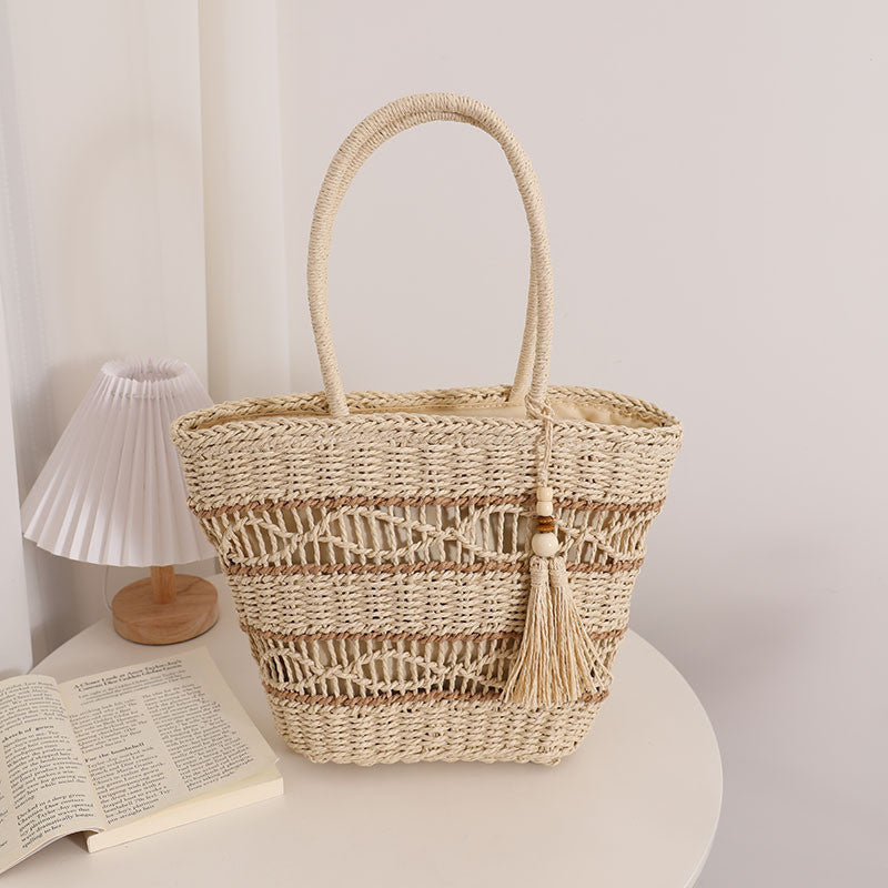 Ielgy Fashion Hollow One-Shoulder Straw Bag Tassel Portable Woven Holiday Style Beach Female Bag