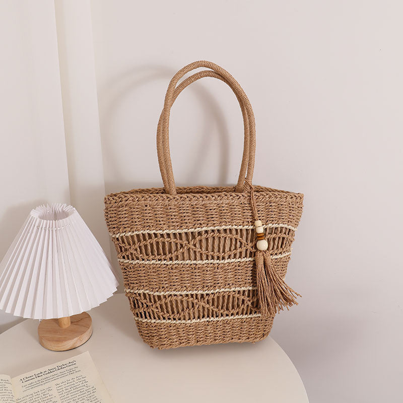 Ielgy Fashion Hollow One-Shoulder Straw Bag Tassel Portable Woven Holiday Style Beach Female Bag