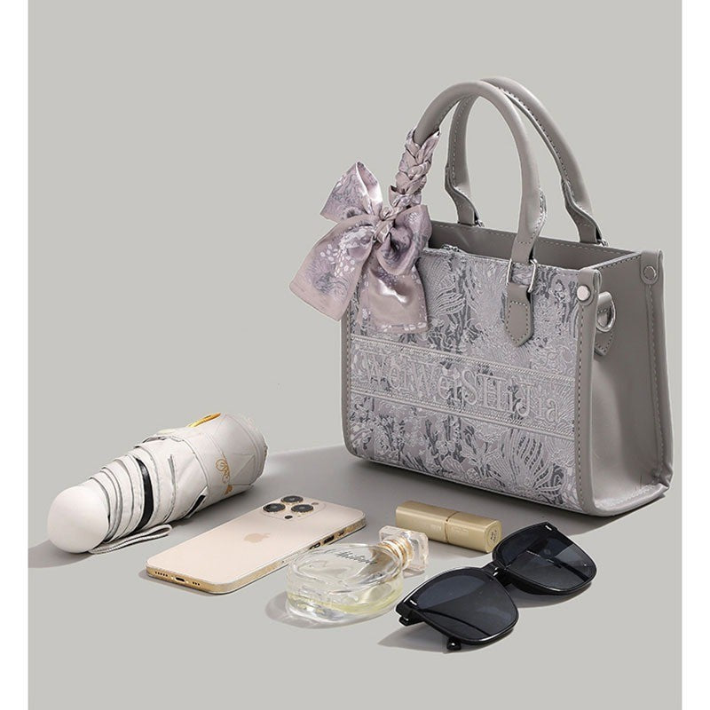 Ielgy Commuter Tote Bag High-End Pattern Embroidery Portable One-Shoulder Diagonal Shopping Bag (Ribbon Style Random Shipping)