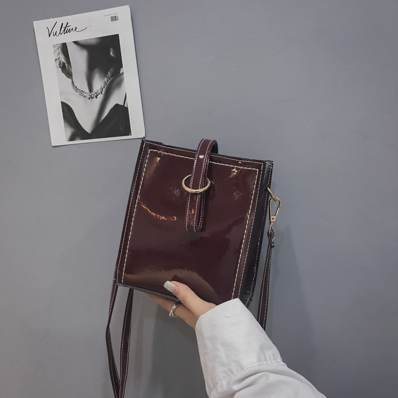 Glossy retro messenger bag