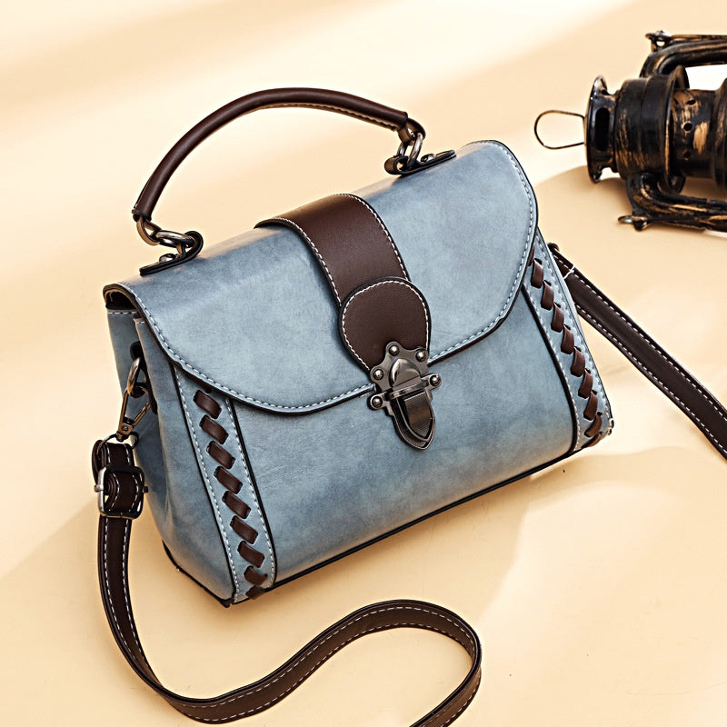 IELGY fashion wear-resistant rivet messenger handbag retro