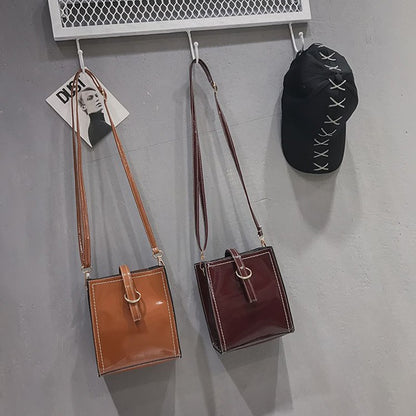 Glossy retro messenger bag