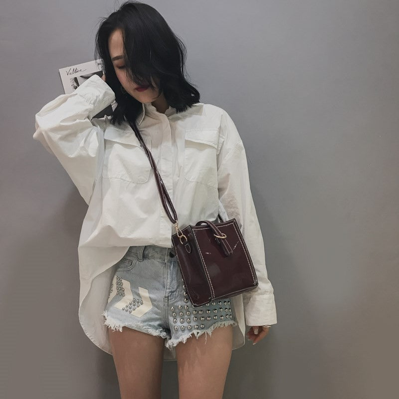 Glossy retro messenger bag