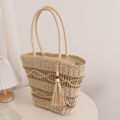 Ielgy Fashion Hollow One-Shoulder Straw Bag Tassel Portable Woven Holiday Style Beach Female Bag